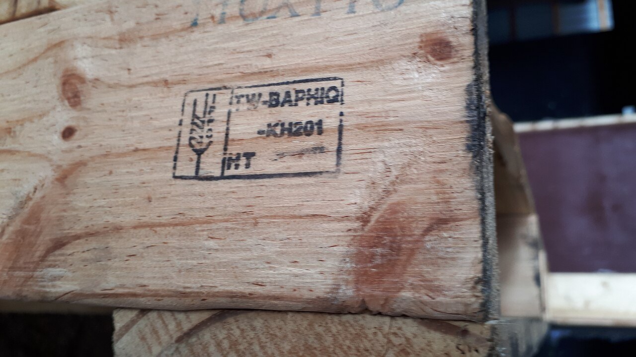 ISPM 15 treatment mark stamped on a wooden pallet